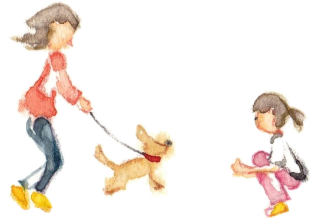 犬の散歩をする親子